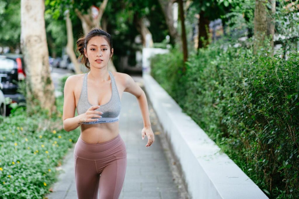 sexy, beautiful and healthy swasth woman jogging in the park